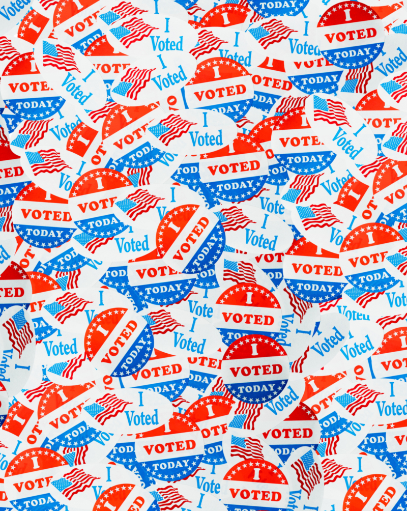 Background created from many election voting stickers or badges